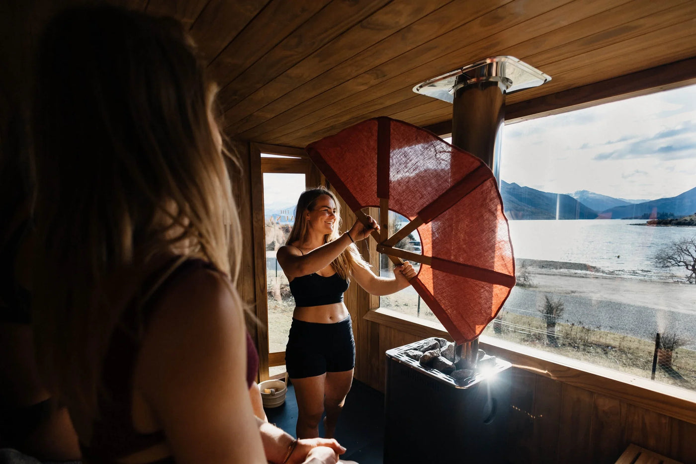 People enjoying a sauna session — sauna for muscle recovery