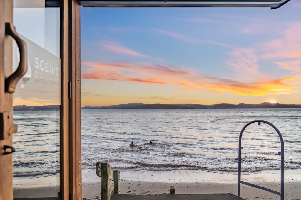 View from sauna door to ocean sunset — science-backed benefits of sauna for sports