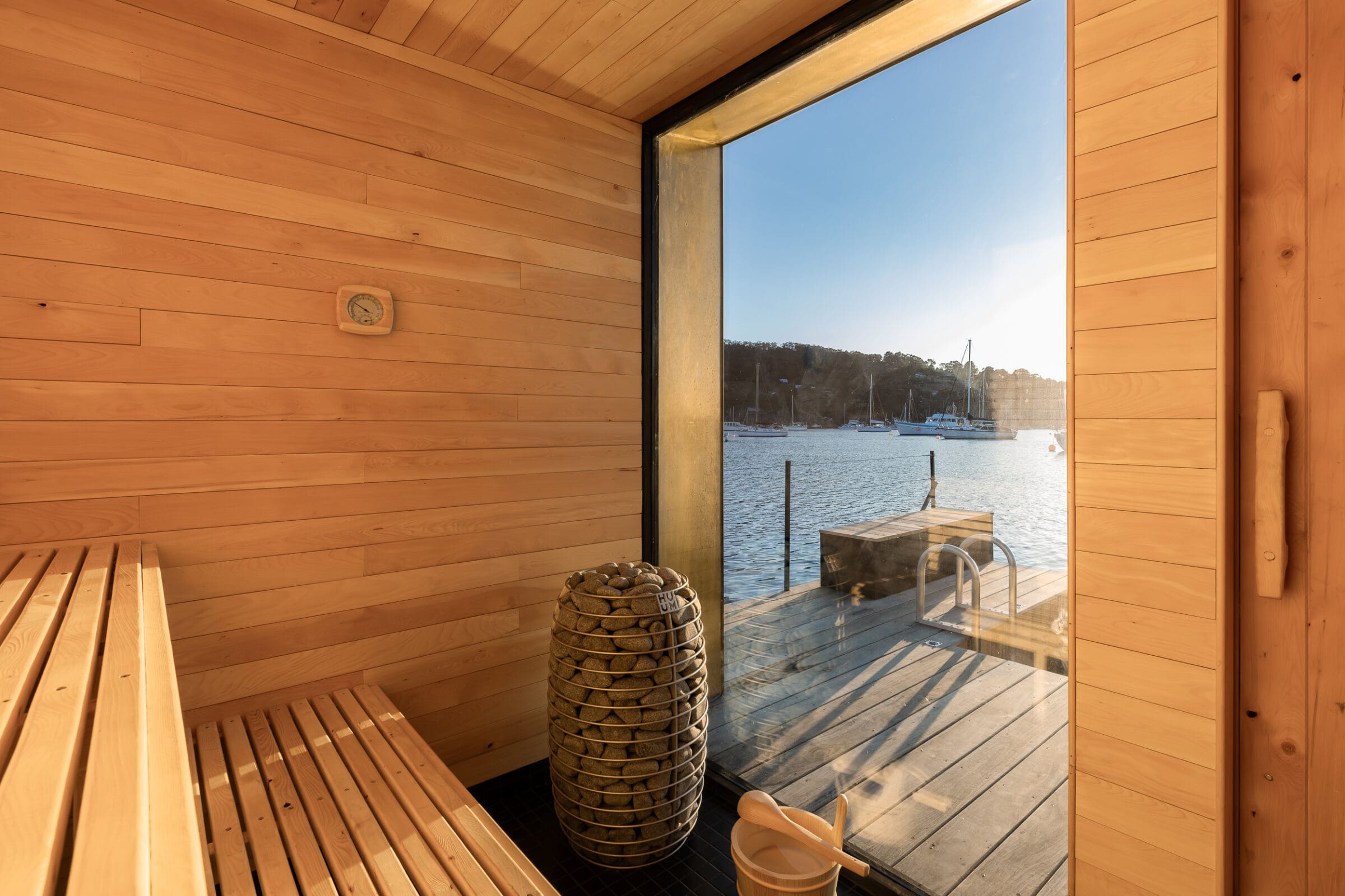 Premium sauna interior with harbour view — the science behind Ri sauna gear