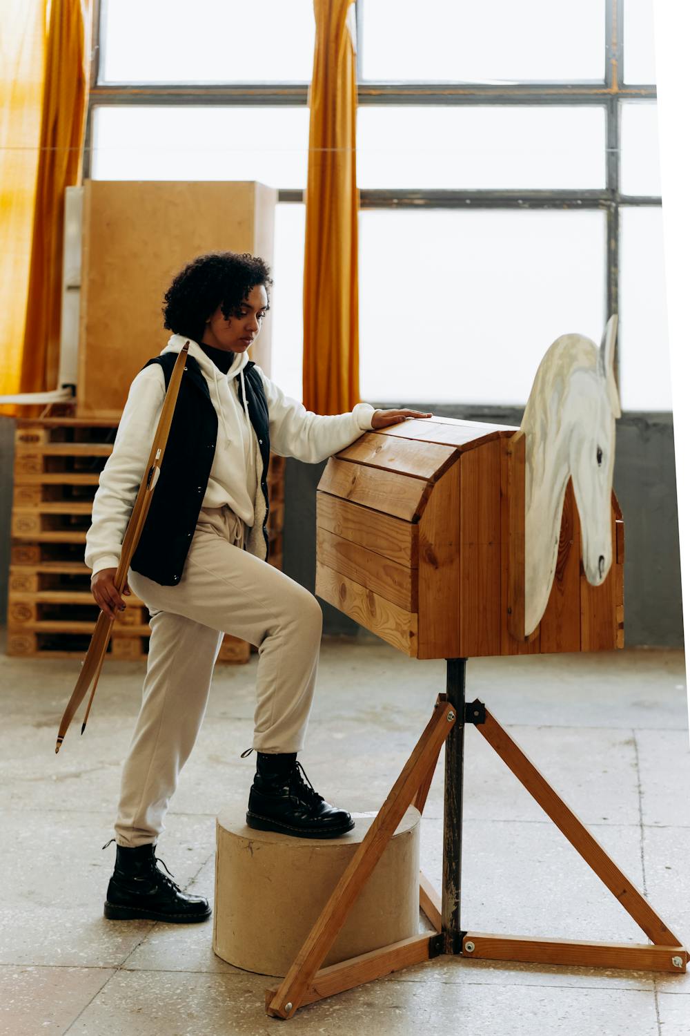 Merino wool sauna hat on warm wooden bench