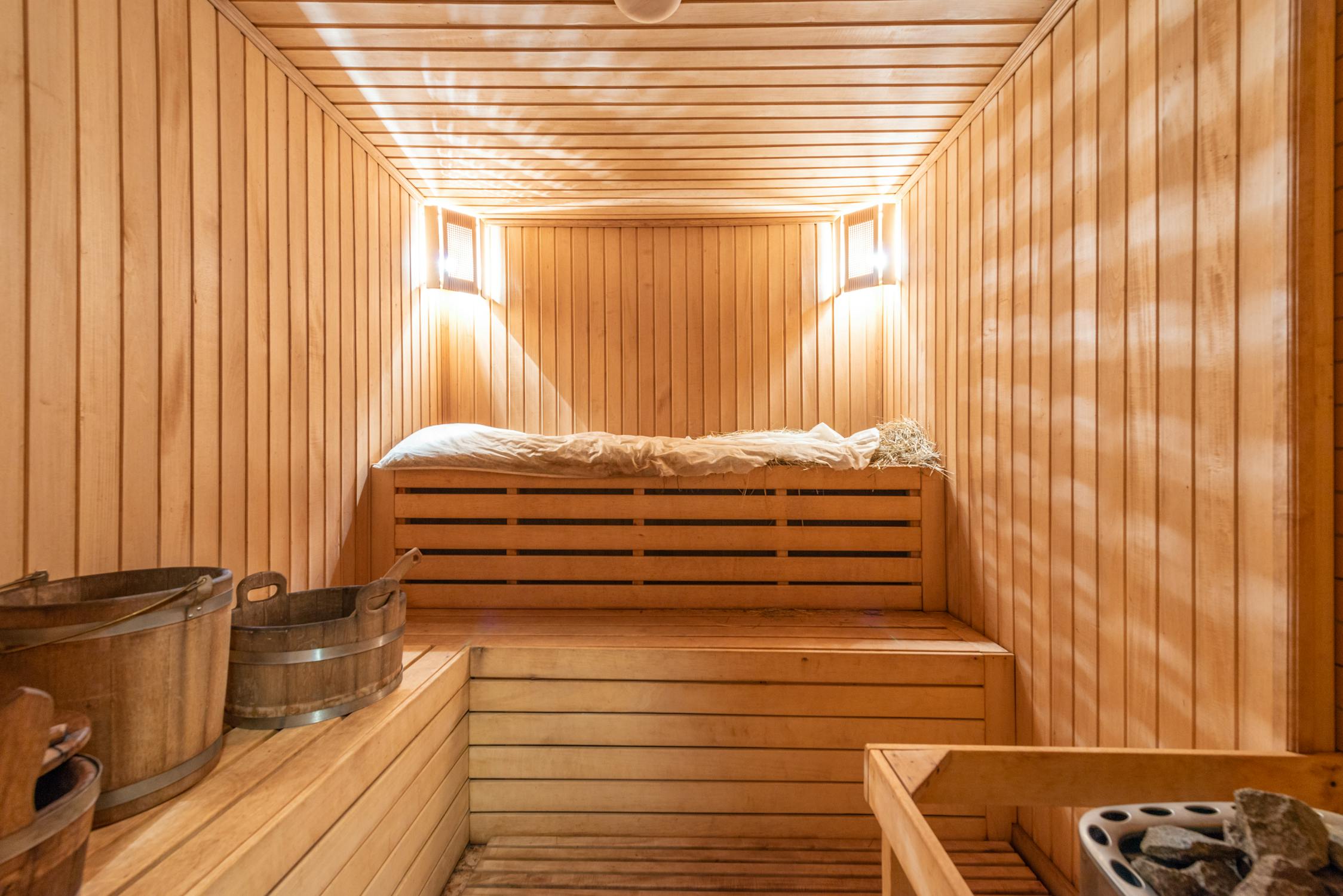 Warm timber sauna interior with ambient lighting